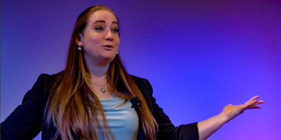 Kara Kelley HR Speaker on stage at an event